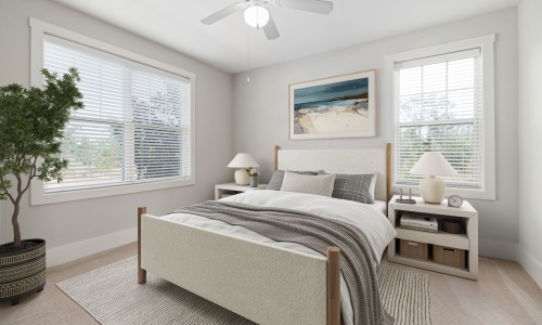 Cozy Bedroom with Stylish Decor A comfortable bedroom featuring a neatly made bed with plush pillows, soft lighting, and tasteful decor. A window provides ample natural light, creating a warm and inviting atmosphere.