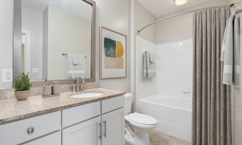 Relaxing Bathroom Suites A serene bathroom suite featuring an oversized soaking tub with a ceramic tile surround, designed for ultimate relaxation
