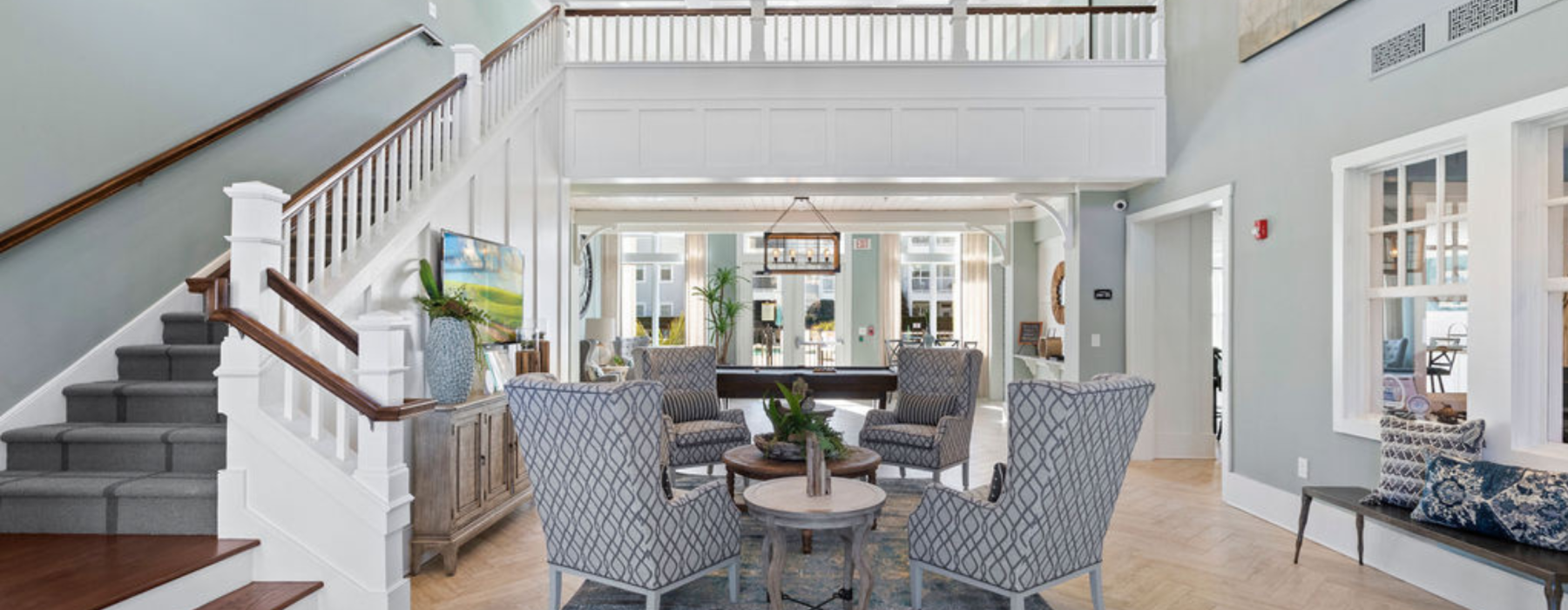 lobby with four chairs and pool table